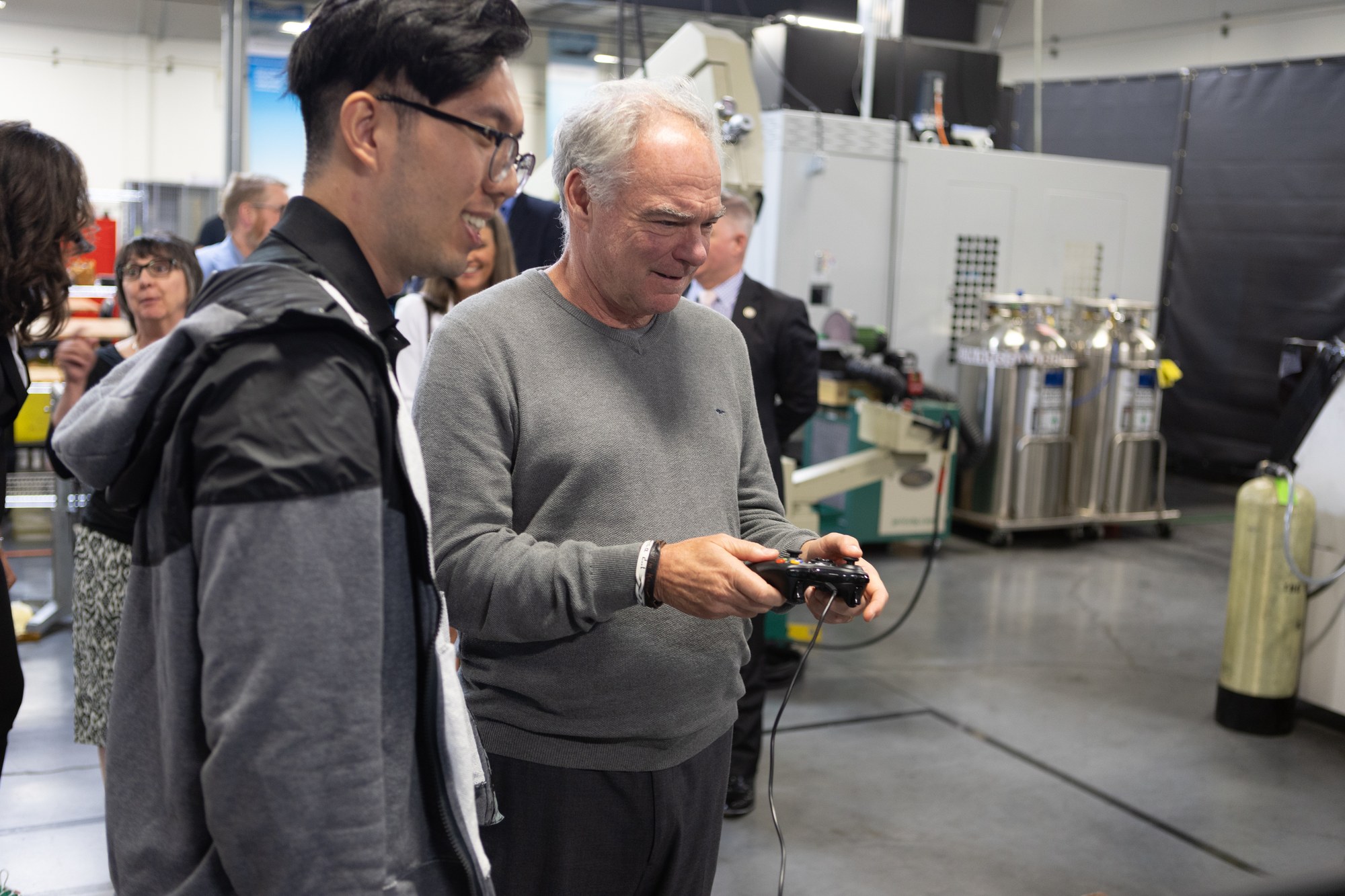 Yiyan Ruan teaching U.S. Senator Tim Kaine to operate the MELD robot